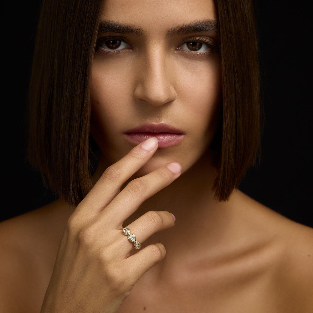 Model wearing gold diamond ring